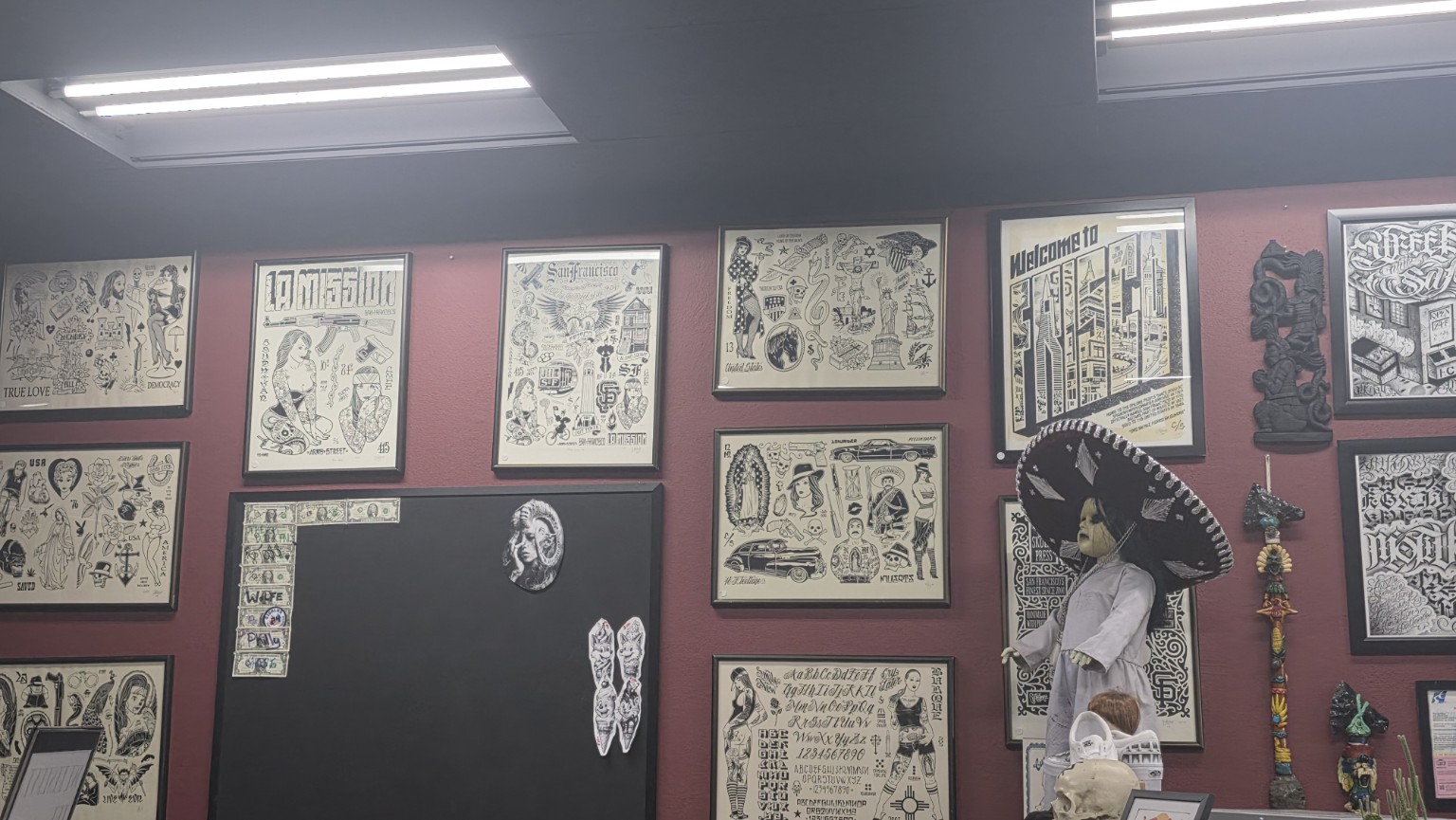 Framed tattoo flash inside Ink Disciples